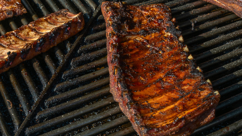 A rack of ribs on the grill