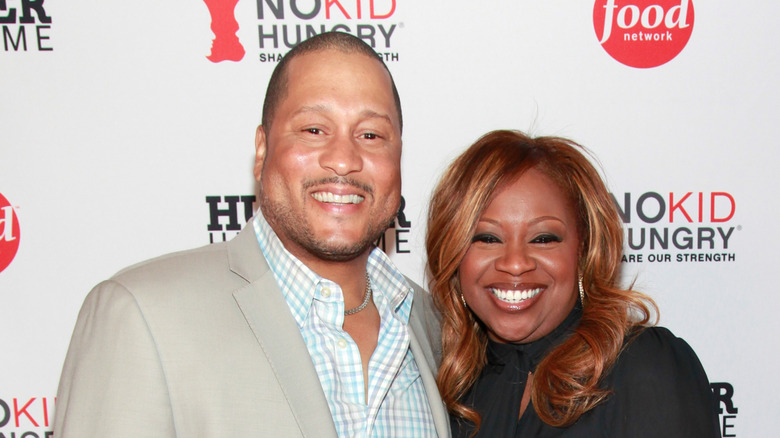 Pat and Gina Neely smiling on a red carpet