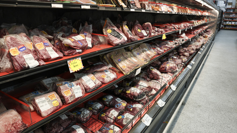fresh beef on the shelves at the grocery store