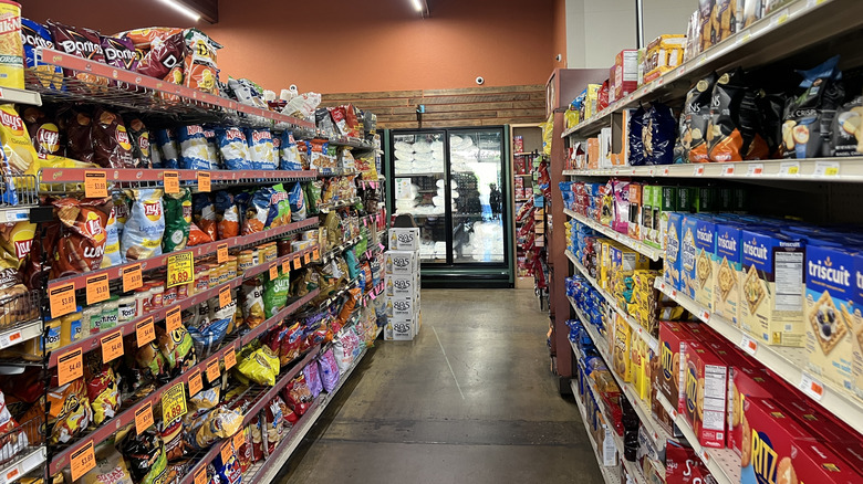 bags of chips and snacks on grocery store shelves