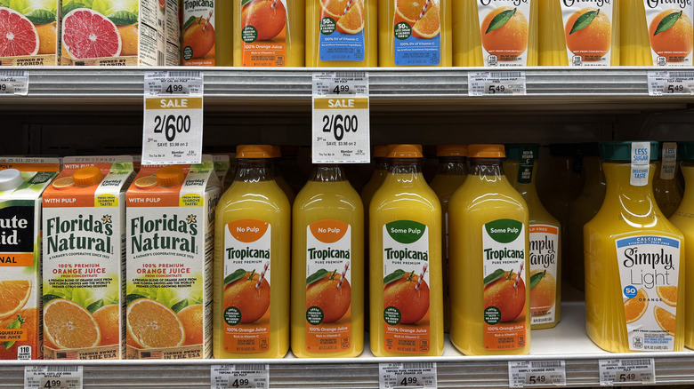 bottles of orange juice at the grocery store