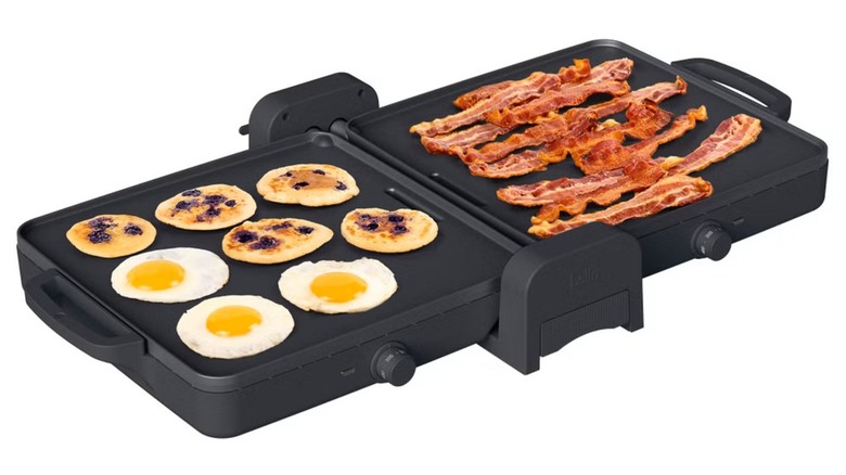 Griddle cooking bacon, eggs, and pancakes.