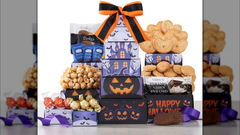 Halloween themed gift box set with cookies, popcorn, and other treats.