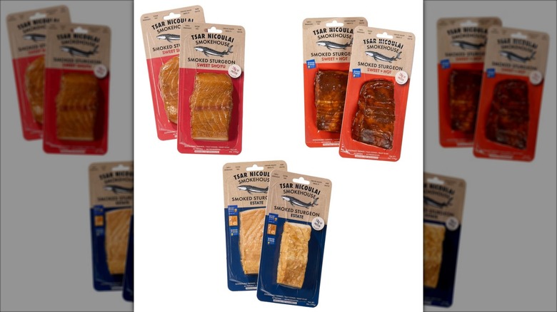 Multiple packs of smoked sturgeon fish in various flavors.