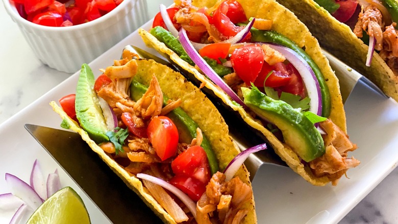 jackfruit tacos with avocado, tomato, cilantro, and lime