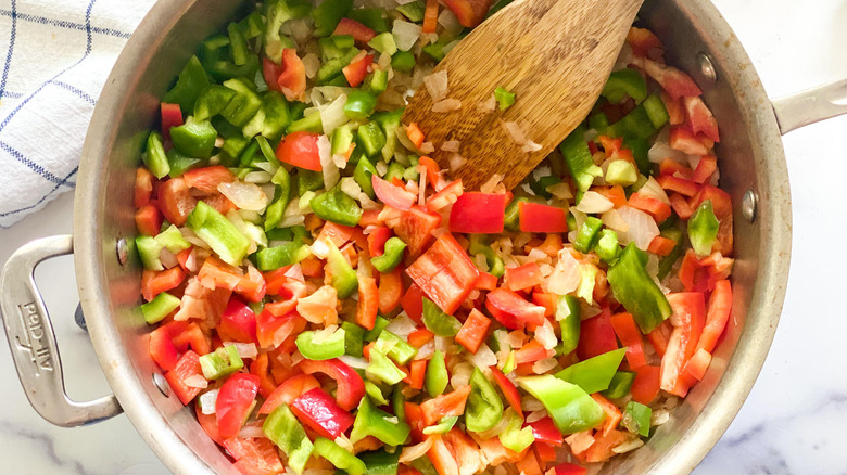 Overhead shot of a metal pot that contains diced onions