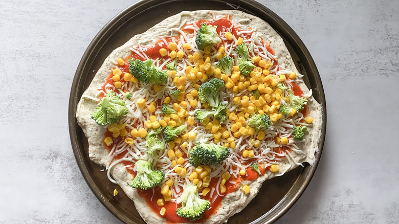 Pizza dough with toppings
