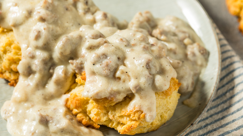 Close up of plate with biscuits and sausage gravy