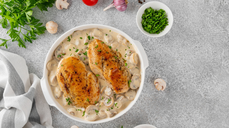 Chicken breasts on top of creamy mushroom sauce