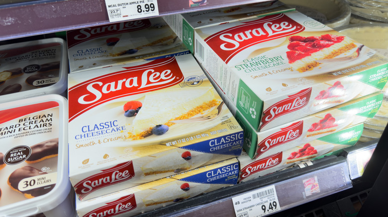 Two stacks of Sara Lee cheesecakes in the freezer aisle