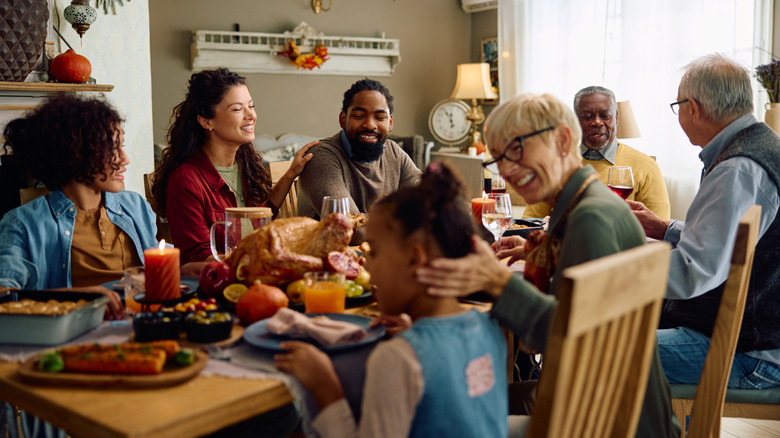 A multigenerational family sitting at the dinner table