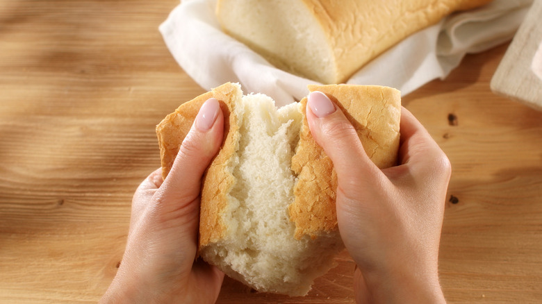 Tearing fresh bread