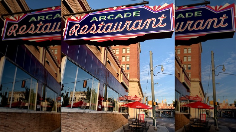 restaurant sign on sidewalk