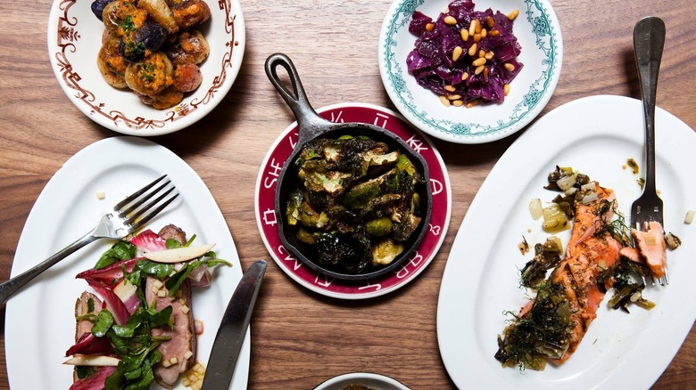Variety of dishes served at Butter Restaurant in Midtown, including salmon, beets, and roast pork