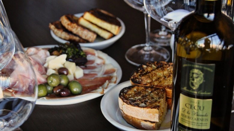 Crostini, Italian cold cuts, and a bottle of wine