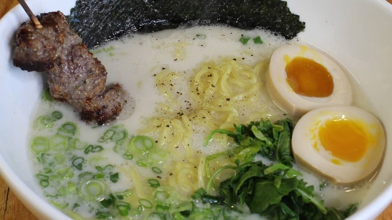 Bowl of ramen at Justin Warner's restaurant with beef, nori, and soft boiled egg