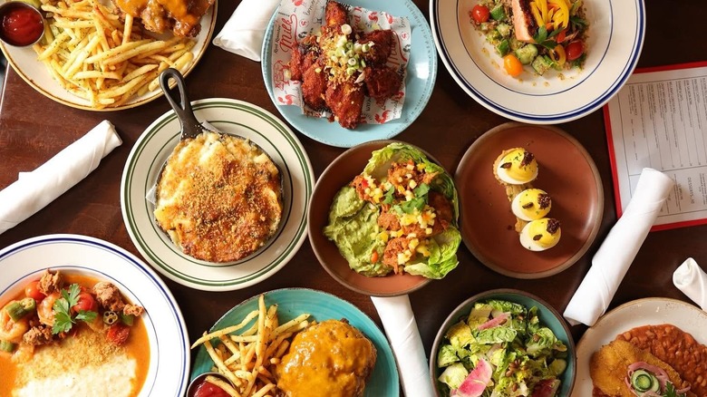 Variety of dishes served at Red Rooster in Harlem, including deviled eggs, french fries, and salads
