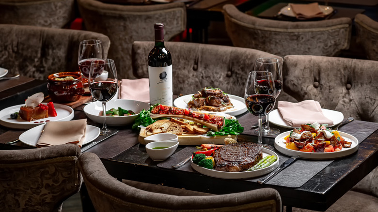 table set with food and wine in a restaurant