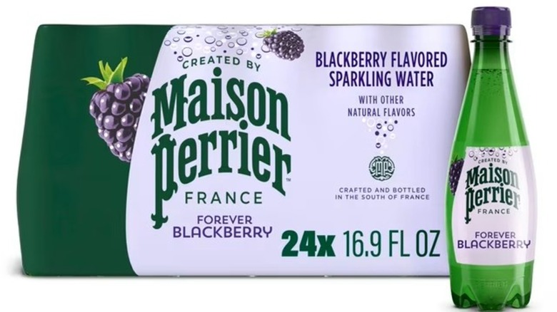 Case and single bottle of Maison Perrier sparkling water against white background.