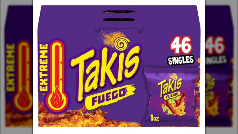 Case of individually bagged Takis rolled tortilla chips against white background.