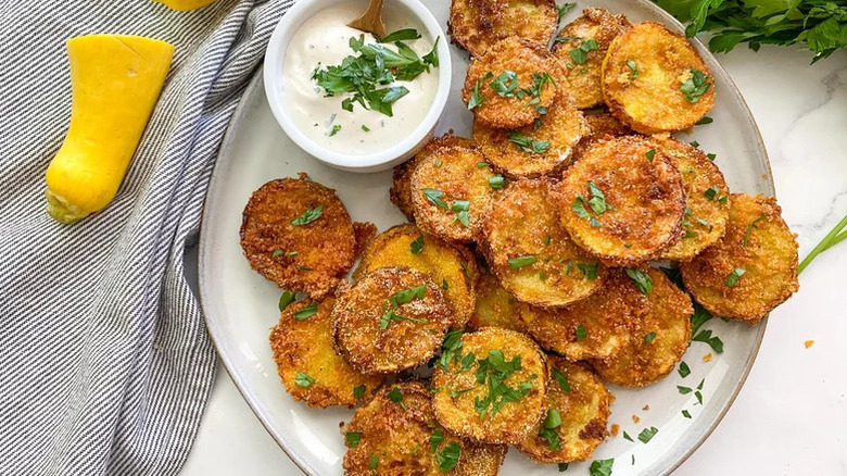 Platter of fried squash slices with dip