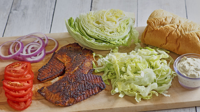 Blackened fish sandwich ingredients on cutting board