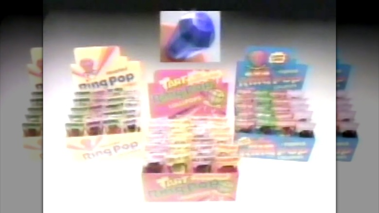 Screenshot from 80s Ring Pop commercial with three boxes of different flavored Ring Pops