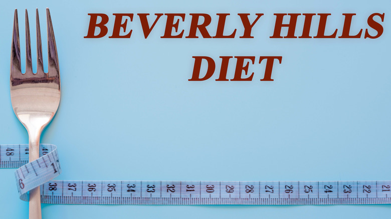 "Beverly Hills Diet" written on a blue background with a measuring tape wrapped around a fork to the left side