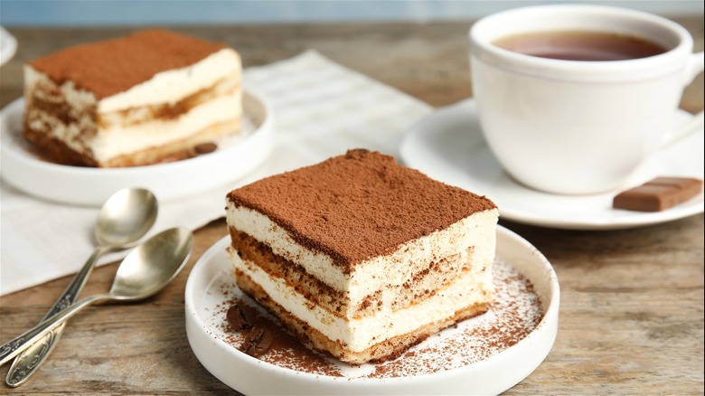 Tiramisu and coffee on table