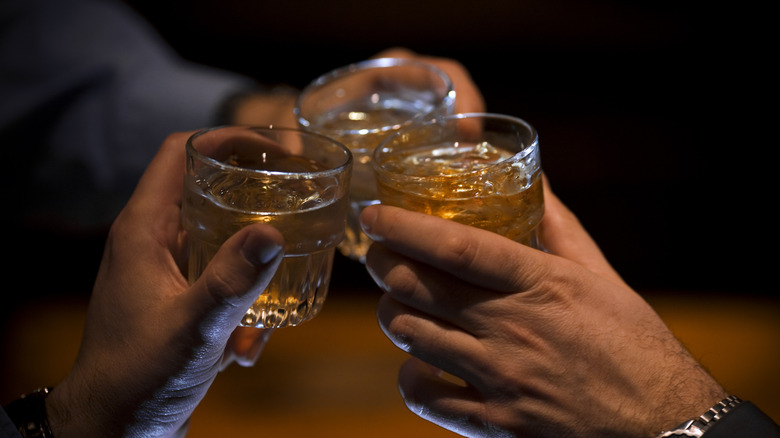 drinking whiskey in cocktail glasses