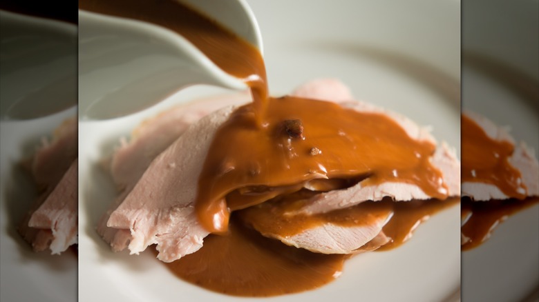 Giblet gravy poured over turkey