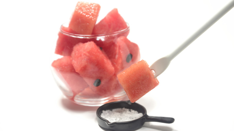 Diced watermelon and a bowl of salt