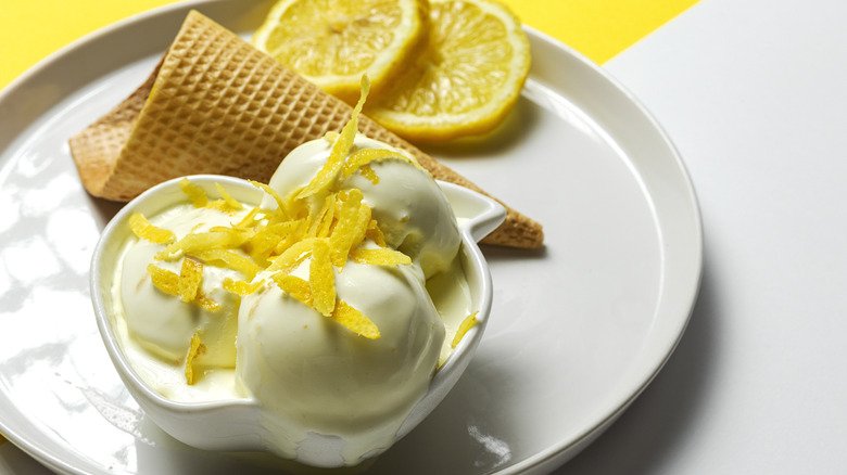 Lemon ice cream on a plate with a cone