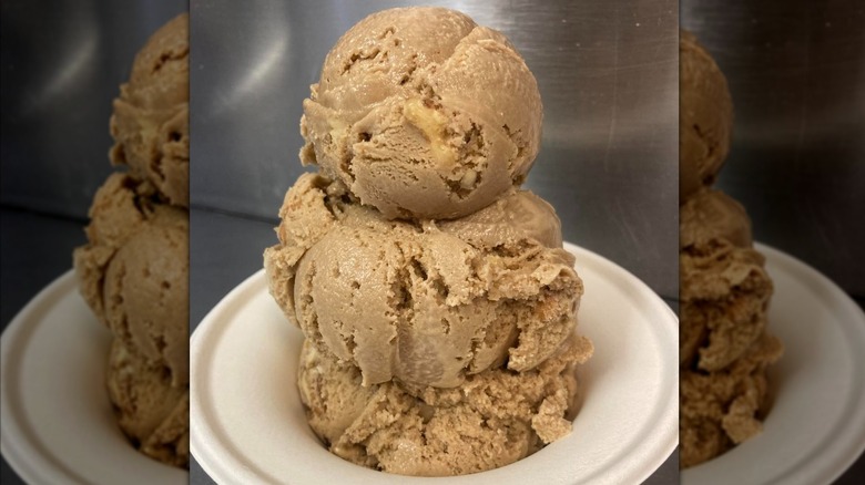 Maple walnut ice cream scoops in a white bowl
