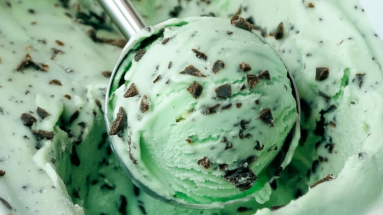 Mint chocolate chip ice cream being scooped