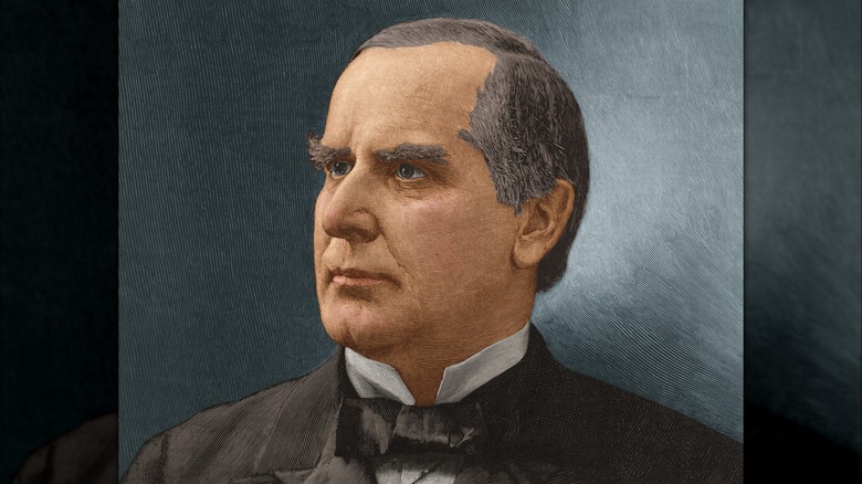 Illustrated portrait of William McKinley with short dark hair, wearing a dark suit and bow tie against a blue background