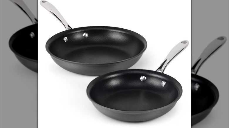 Two nonstick sauté pans on a white background