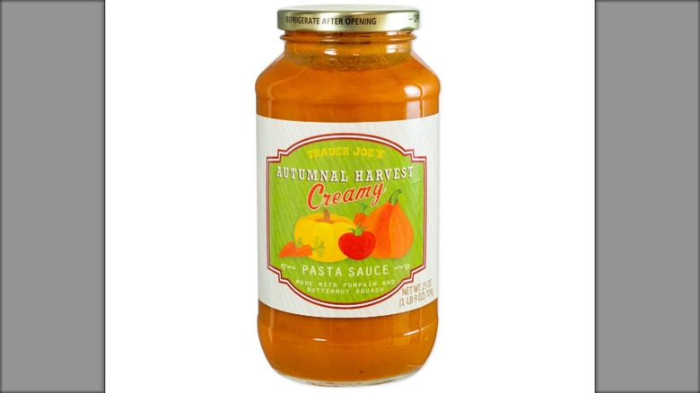Jar of Trader Joe's  Autumnal Harvest Creamy Pasta Sauce against white background.