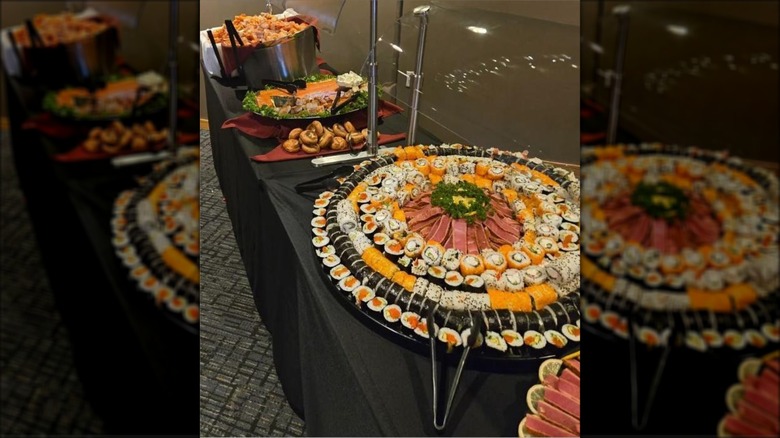 An array of sushi at a seafood buffet