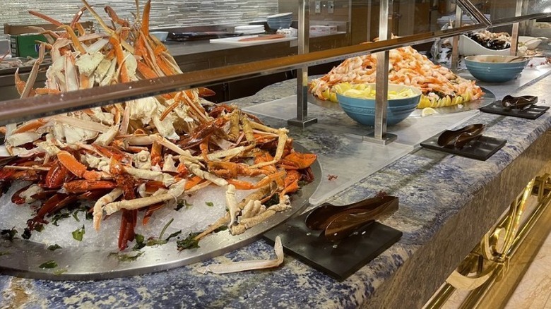 Snow crab and lobster piled high at a buffet