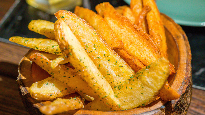 Steak fries in a wooden bowl
