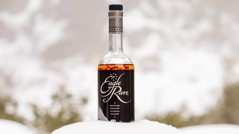 Bottle of Eagle Rare sitting in the snow