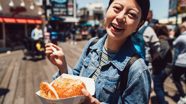 Woman with chowder bread bowl