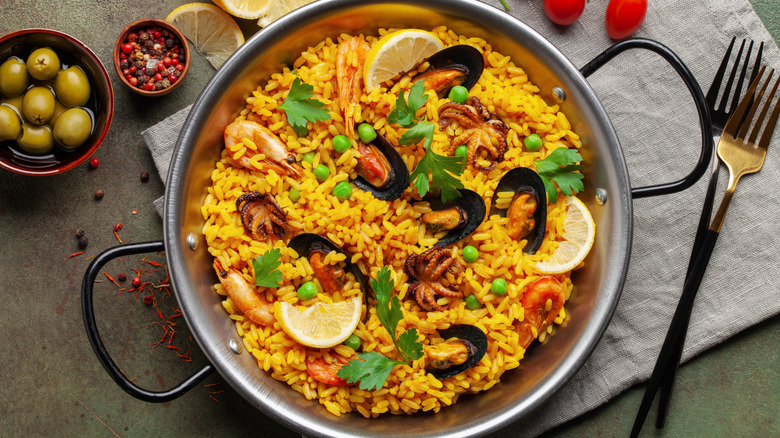 Top view of a large pan of seafood paella