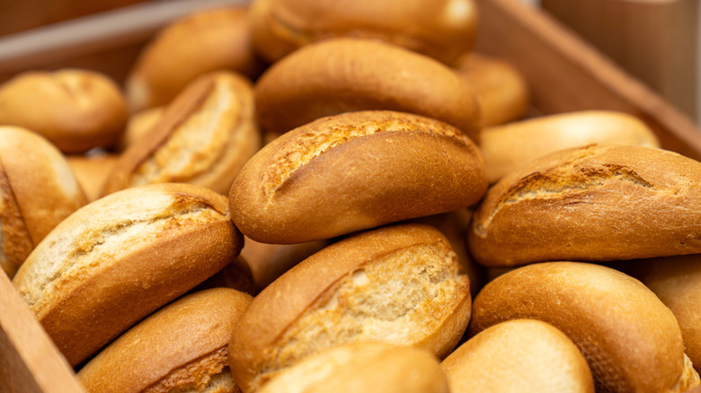 Close-up on a wooden basket of bread rolls