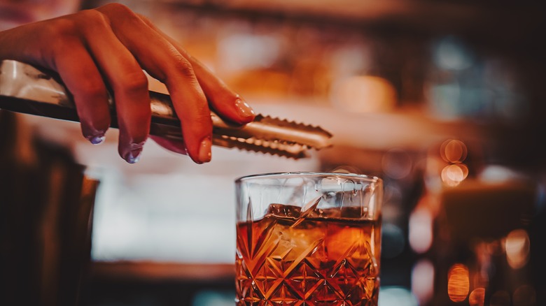 a bartender making a classic cocktail