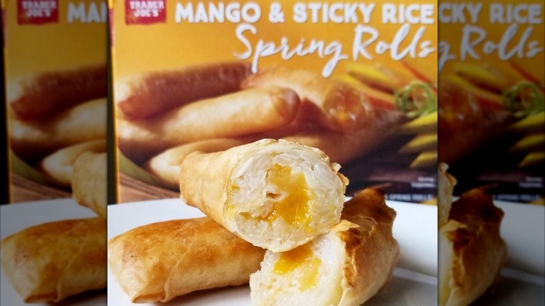 halved Trader Joe's mango & sticky rice spring roll with the box in the background