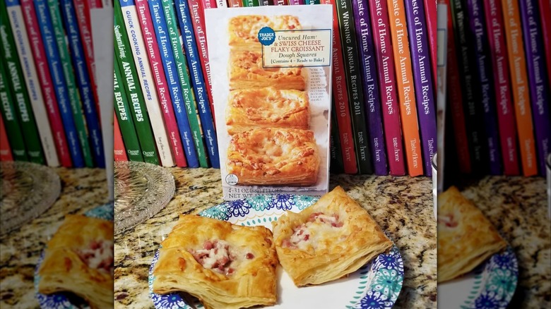 box of Trader Joe's ham and swiss croissants with two prepared croissants in front