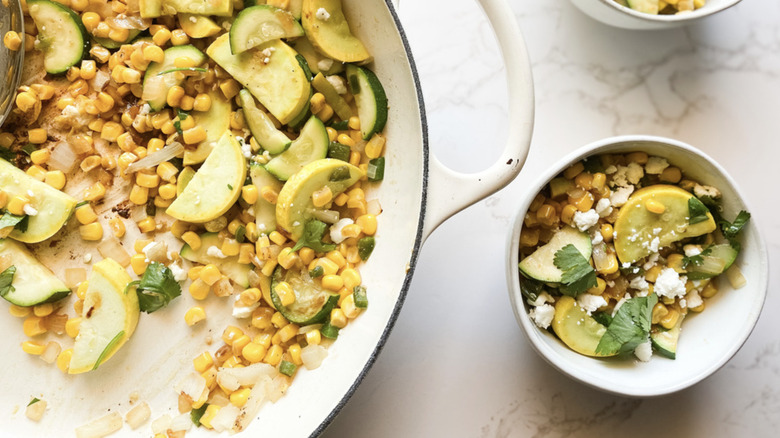 Bowl and skillet filled with calabacitas