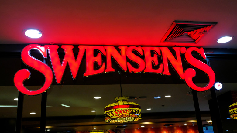 lighted sign of Swenson's at night